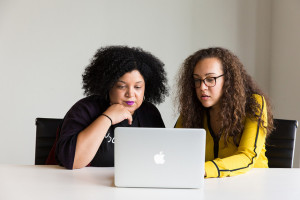 Two women working at a computer