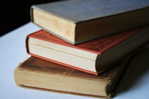 This is a photo of a stack of three hold books.