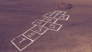 A photo of a hopscotch grid on the sidewalk.