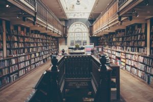 This is an interior photograph of a public library filled with books.