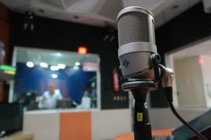 This is a close-up photo of a microphone in a studio.