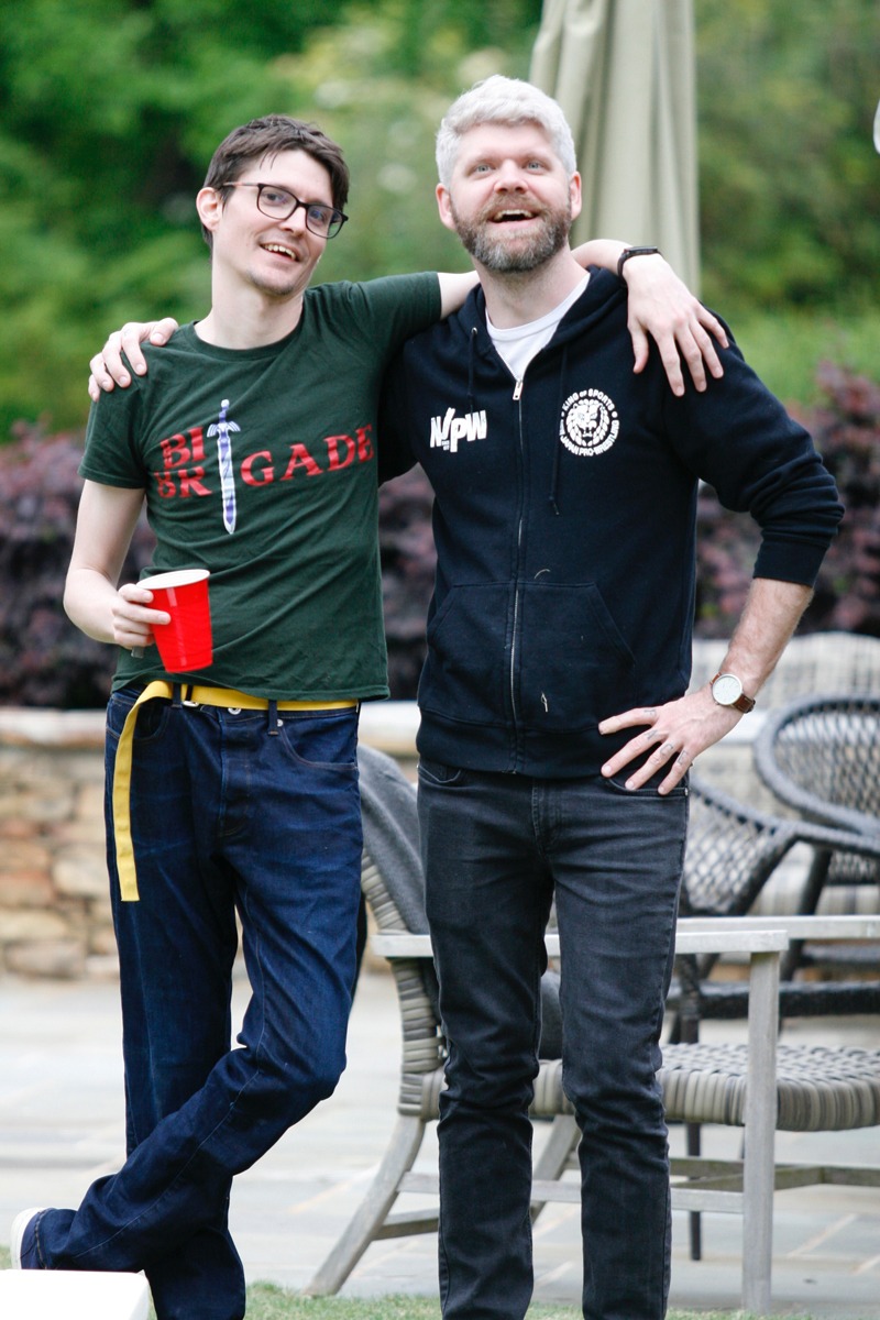 A photo image of WebDevStudios Senior Backend Engineer, Zach Owens, and Lead Frontend Engineer, Corey Collins. Corey is the author of the blog post, "Breaking the Cycle of the Mean Developer." In this image, Zach and Corey are standing, facing the camera, smiling, and have an arm around each other's shoulders.